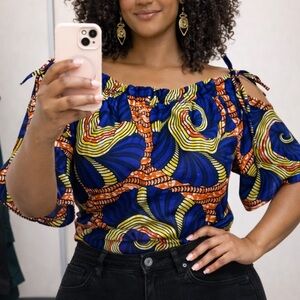 Vibrant Ankara style relaxed shoulder top office wear, travel outfit